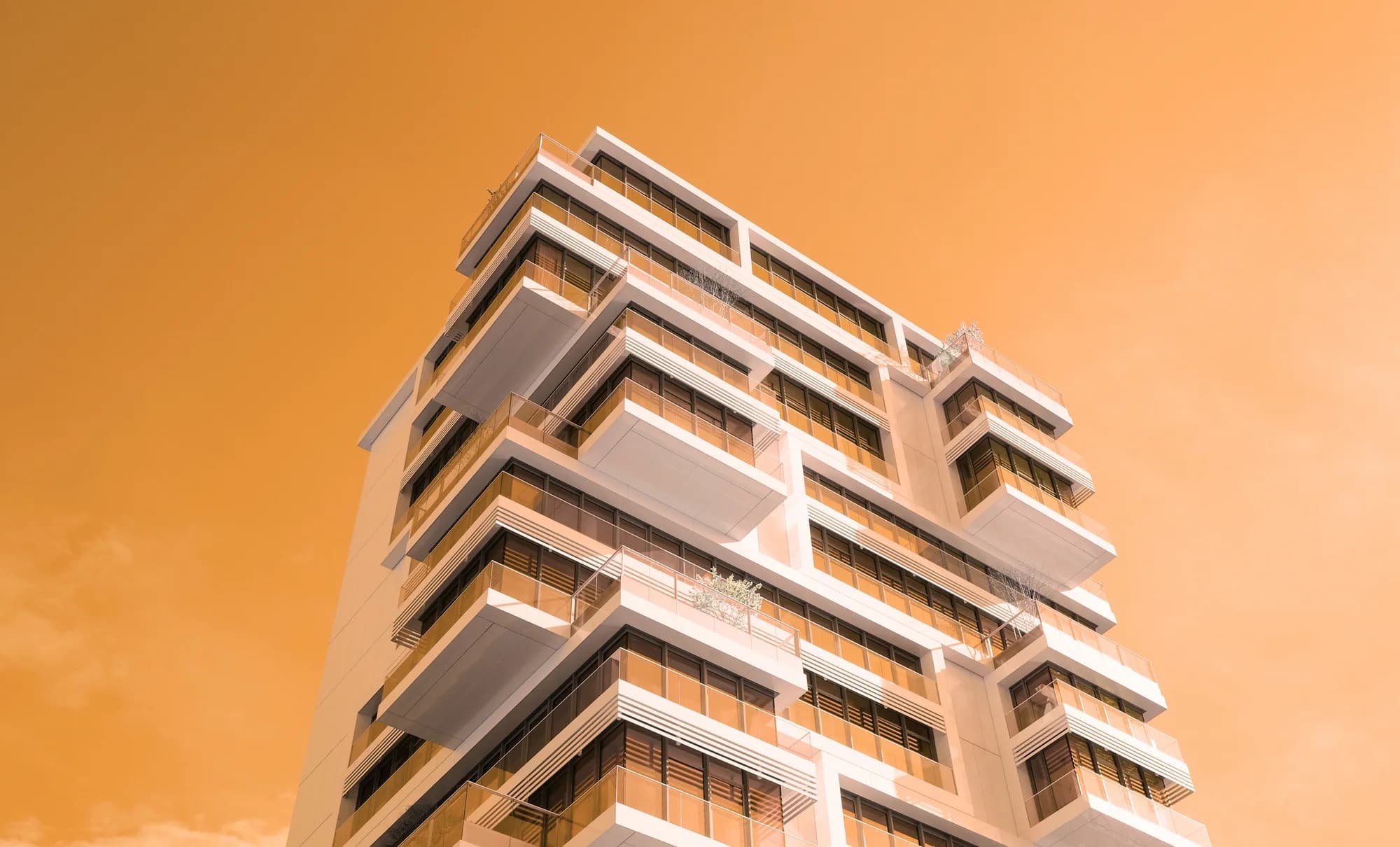 Brotherhood Group's head office building in Malé, photographed from street level against a warm sky