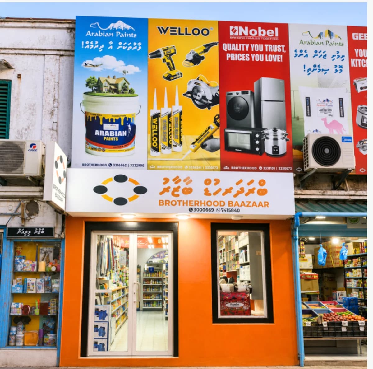The orange shopfront of Brotherhood Baazaar on Boduthakurufaanu Magu, opposite Malé Harbour