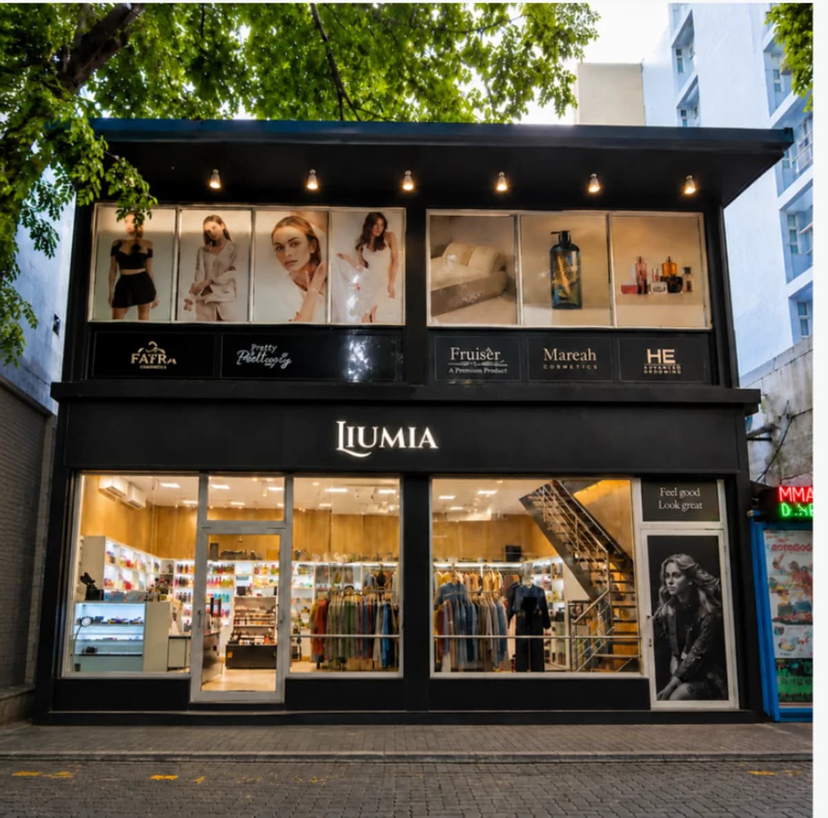 The two-storey Liumia Style shopfront in Malé, with lit window displays